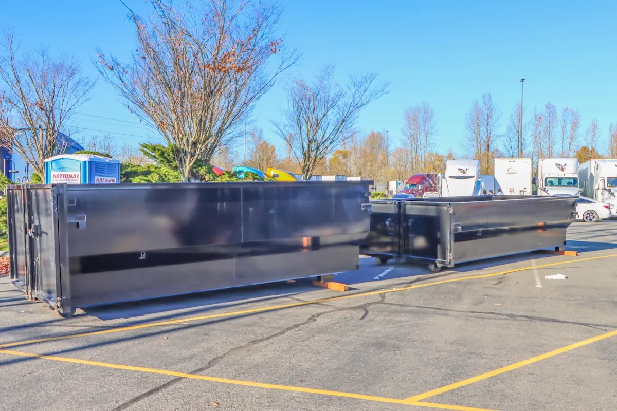 Professional dumpster rental service with roll-off container on residential driveway in Duarte